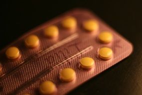 yellow small pills in pack