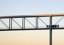 people on the iron bridge