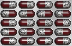 drugs in brown-white capsules