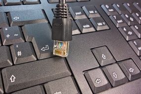 usb cable and a black keyboard