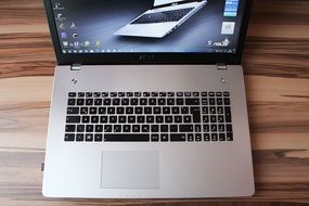 laptop on a wooden table