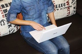 white laptop on the girl's lap