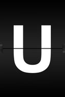 white alphabet capital letter U on black sheets background