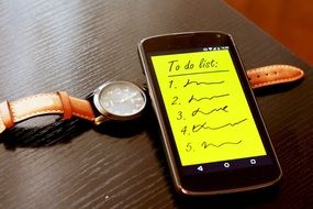 smartphone and watch with to do list