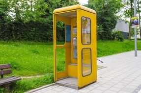 yellow phone booth in the park