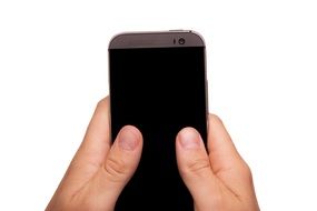 Black smartphone in the hands on white background