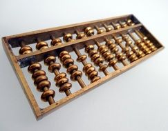 wooden abacus on a white surface