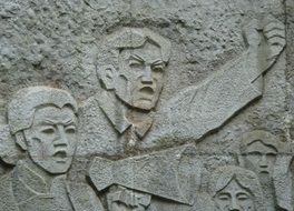 stone carving in the form of revolutionaries