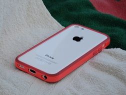 white iphone in pink case