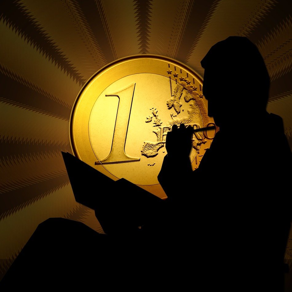 Male silhouette at the background of the euro coin