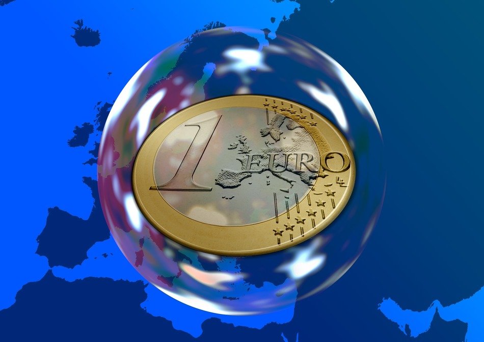euro coin inside the soap bubble on the map