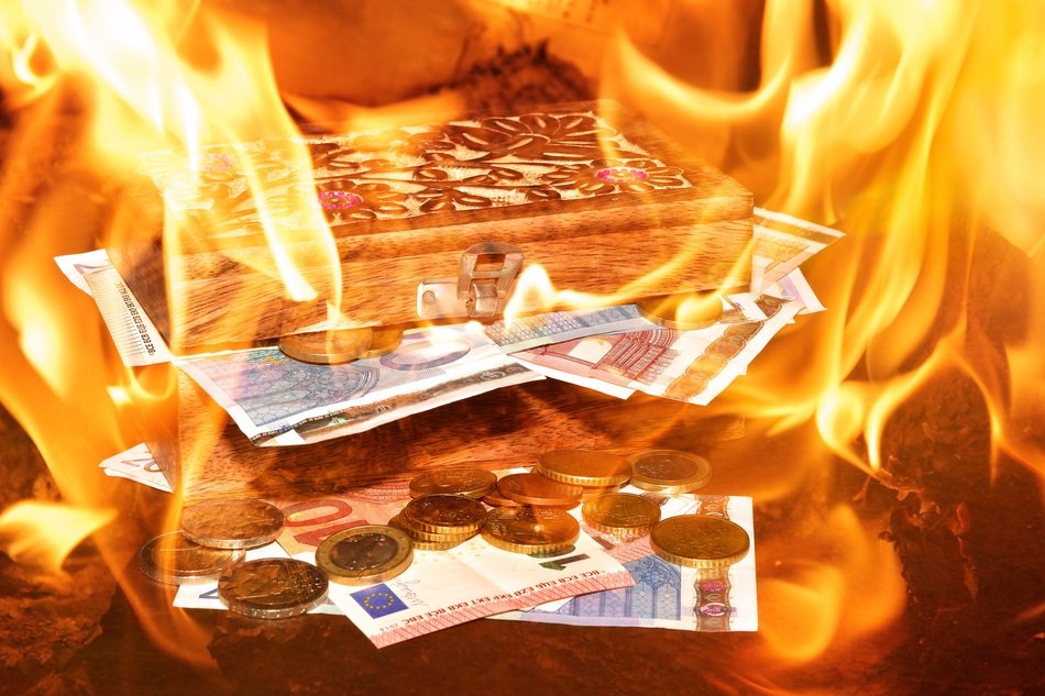 money on fire as symbolism