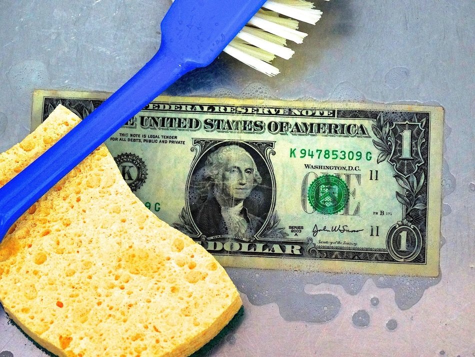 sponge, brush and dollar