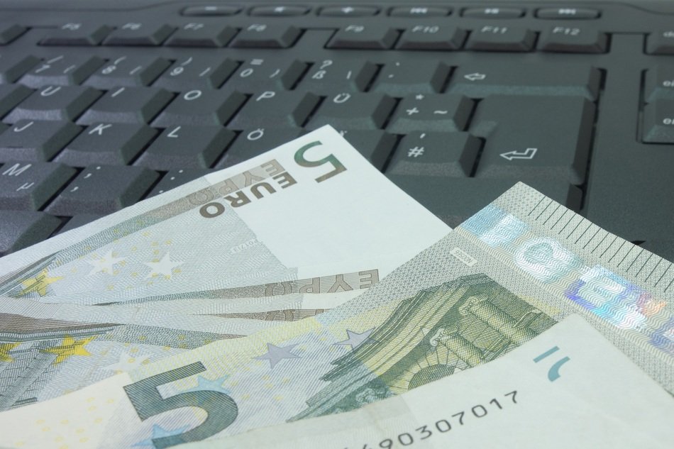 Euro banknotes on the keyboard