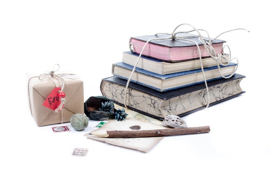 cardboard box and pile of books