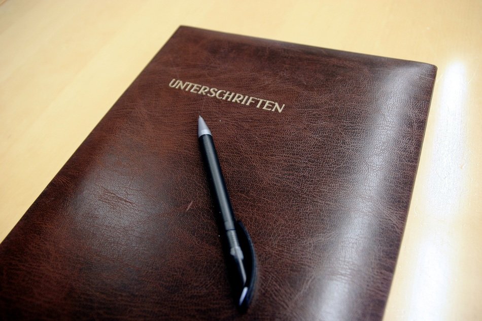 black pen on leather portfolio