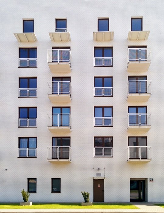 facade of a white apartment building