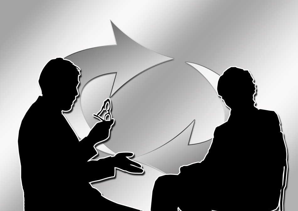 silhouettes of people on a background of swirling arrows