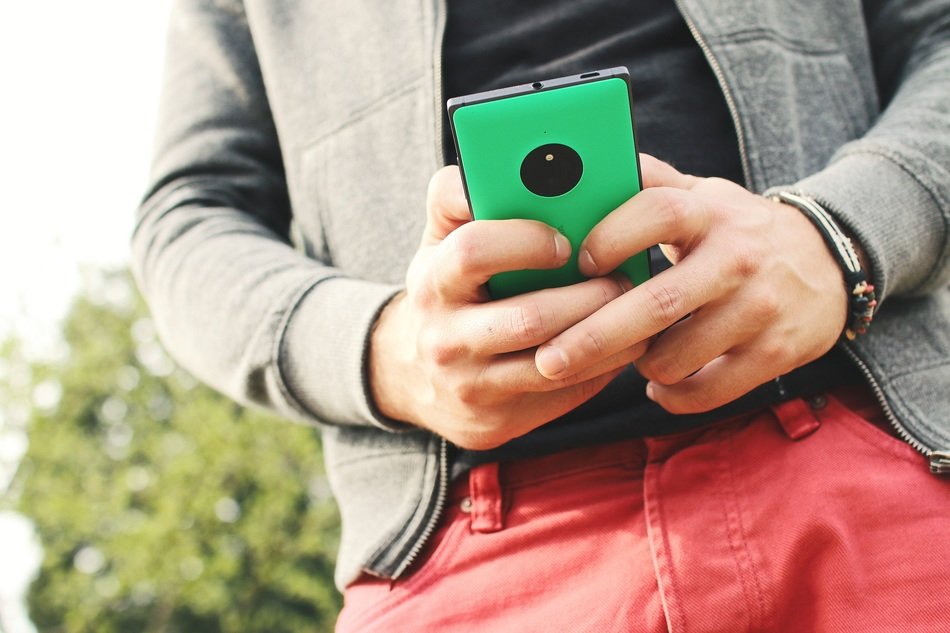 green mobile in the hand