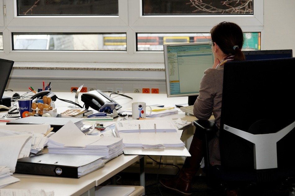secretary works in the office at the table