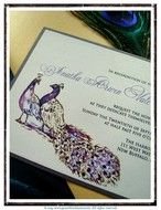 wedding invitation with drawings of peacocks