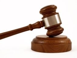 wooden brown judge gavel on a white background