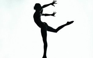 silhouette of a gymnast