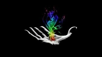computer generated image of a multi-colored flame on a hand