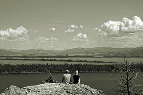 black and white photo of a couple on the shore of Jenny Lake in Wyoming