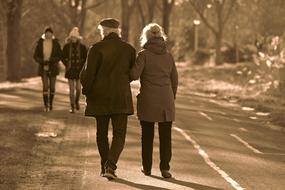 black and white photo, couples walking in the park