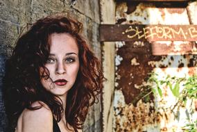 portrait of a red curly woman