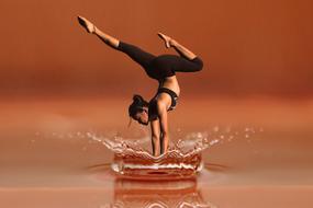 young girl stands on hands in water splash, collage