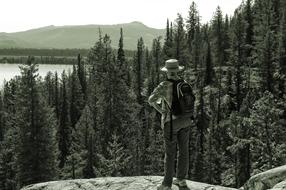 woman on rock Overlooking Jenny Lake, usa, Wyoming, Grand Teton National Park