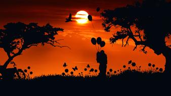 couple romantic balloons at sunset