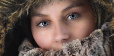 Woman with the beautiful blue eyes close-up