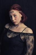 young caucasian woman in black clothing