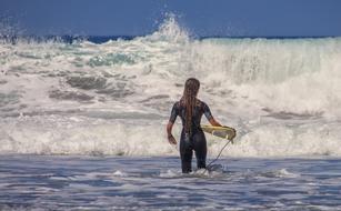 surfer meets ocean waves