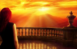 red-haired girl on the balcony against a background of golden sunset