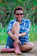 dark-skinned girl in a plaid shirt