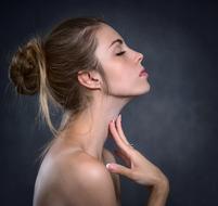 beautiful woman with bare shoulders in profile