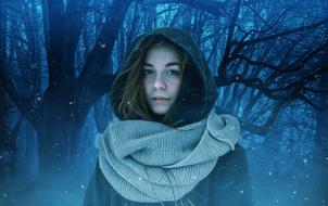 girl in a hood with a scarf on a background of a fairy forest