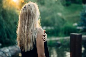 back view of Girl with Blonde Hair outdoor