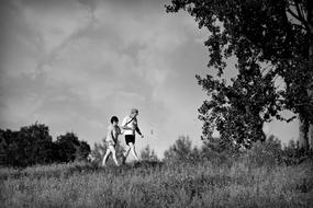 monochrome picture of walking couple in summer day