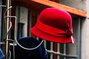 red female hat on a hanger