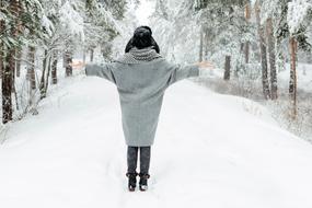 happy woman in the winter forest