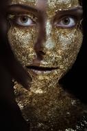 Woman Beauty Girl with gold on face