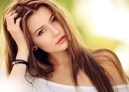 photo of a pensive long-haired girl