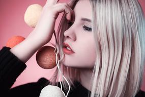 young blonde Girl at Pink background