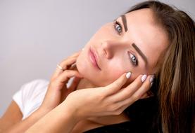 photo of a girl with palms in her face