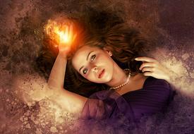 fantasy portrait of pretty young girl with flame on hand